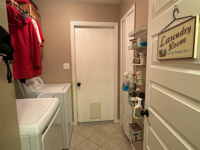 746 Pecan Ln, Cottonwood Shores, TX 78657 - laundry area featuring washer and clothes dryer and light tile patterned floors
