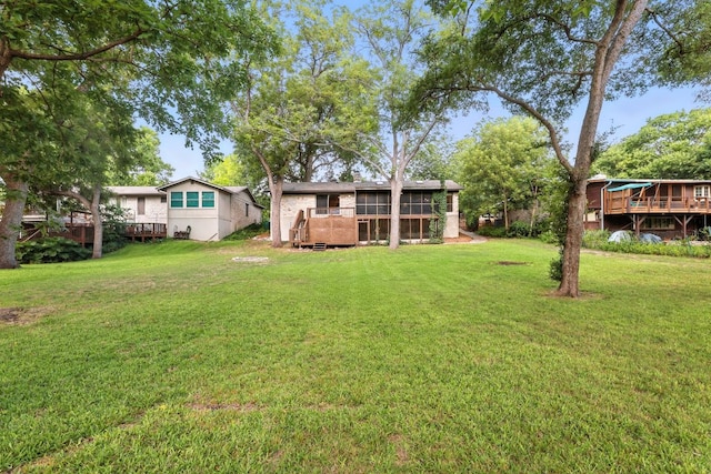 11915 River Oaks Trl, Austin, TX 78753 - view of grassy yard with a deck