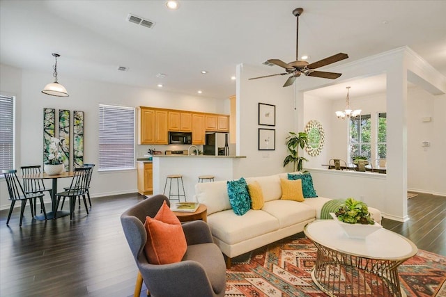 2211 Wilson St, Austin, TX 78704 - living room with dark wood-style flooring, a chandelier, recessed lighting, and a ceiling fan