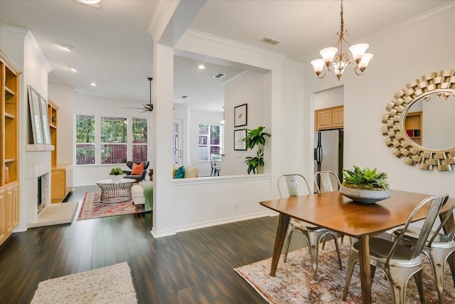 2211 Wilson St, Austin, TX 78704 - dining area with ceiling fan, dark wood-style flooring, a chandelier, crown molding, and recessed lighting