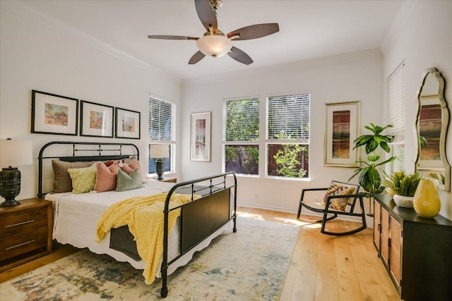 2211 Wilson St, Austin, TX 78704 - bedroom with crown molding, light wood-style floors, and ceiling fan