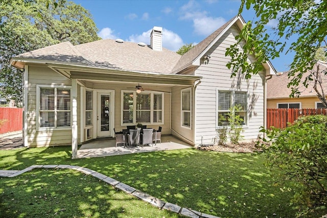 2211 Wilson St, Austin, TX 78704 - rear view of property featuring ceiling fan, a chimney, a patio, and roof with shingles