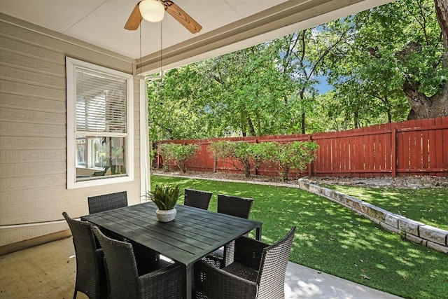 2211 Wilson St, Austin, TX 78704 - fenced backyard featuring a ceiling fan and outdoor dining space