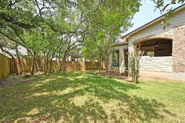 12304 Buvana Dr, Austin, TX 78739 - fenced backyard featuring a ceiling fan