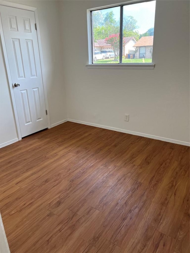 1104 Speer Ln, Austin, TX 78745 - unfurnished room featuring baseboards and wood finished floors