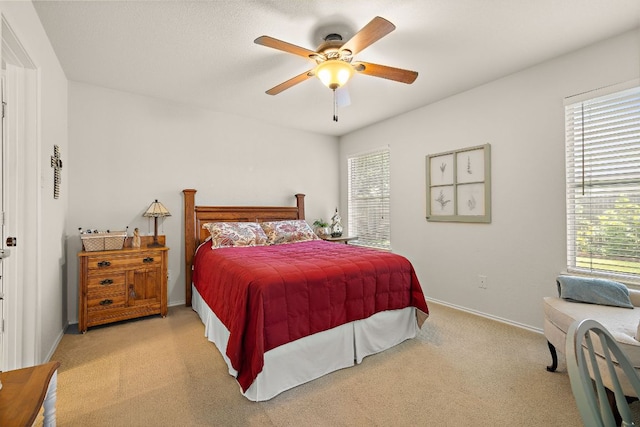 1113 Burgess Dr, Leander, TX 78641 - carpeted bedroom featuring multiple windows and ceiling fan