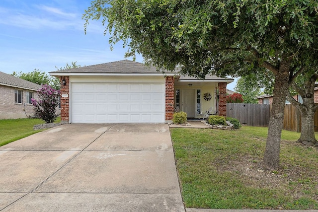 1113 Burgess Dr, Leander, TX 78641 - ranch-style house with brick siding, concrete driveway, and a garage