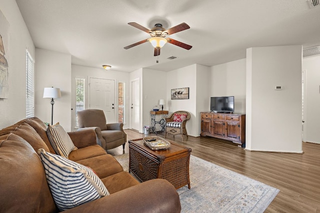 1113 Burgess Dr, Leander, TX 78641 - living area with a ceiling fan and wood finished floors