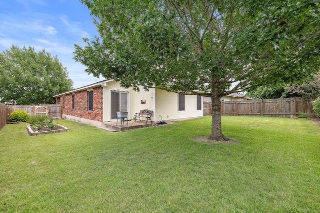 1113 Burgess Dr, Leander, TX 78641 - fenced backyard with a patio area