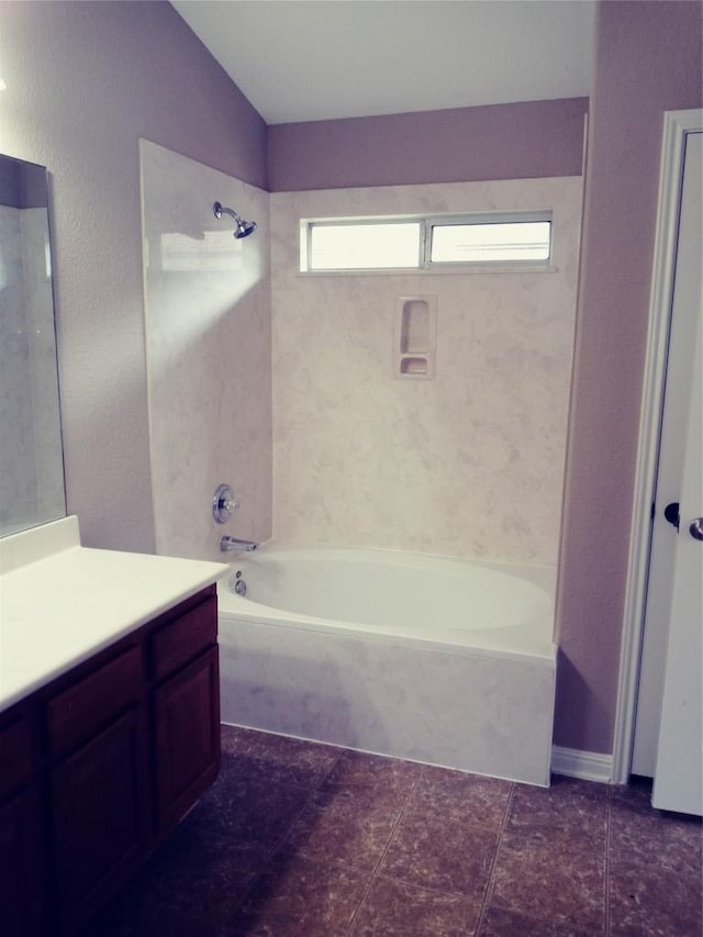 3304 Wickham Ln, Austin, TX 78725 - bathroom with vanity,  shower combination, and vaulted ceiling