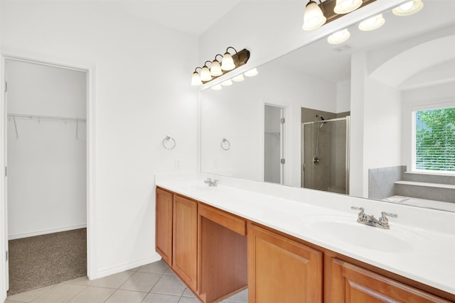 2310 Dervingham Dr, Cedar Park, TX 78613 - bathroom featuring a shower stall, tile patterned flooring, double vanity, and a walk in closet