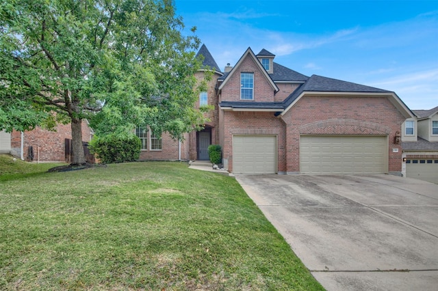 2310 Dervingham Dr, Cedar Park, TX 78613 - view of front of home featuring brick siding, a front lawn, driveway, and an attached garage