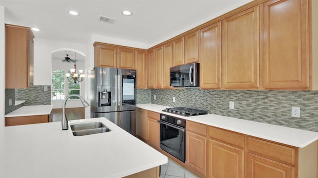 2310 Dervingham Dr, Cedar Park, TX 78613 - kitchen featuring appliances with stainless steel finishes, a chandelier, decorative backsplash, light countertops, and recessed lighting