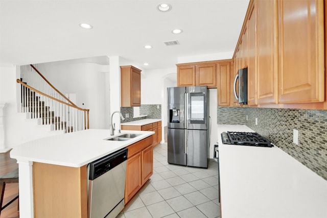 2310 Dervingham Dr, Cedar Park, TX 78613 - kitchen with appliances with stainless steel finishes, light tile patterned flooring, decorative backsplash, light countertops, and recessed lighting