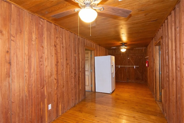 2874 Fm 1704, Elgin, TX 78621 - unfurnished room featuring wood walls, a ceiling fan, light wood-type flooring, and wood ceiling