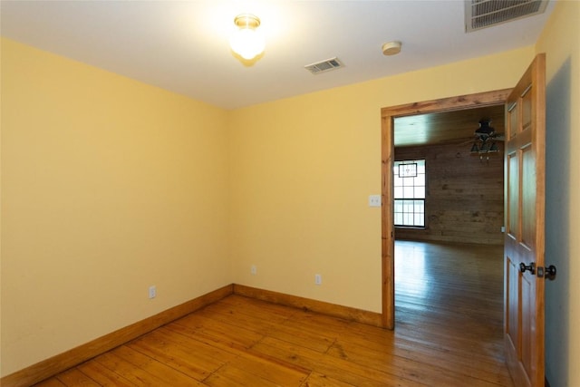 2874 Fm 1704, Elgin, TX 78621 - spare room featuring wood-type flooring and a smoke detector