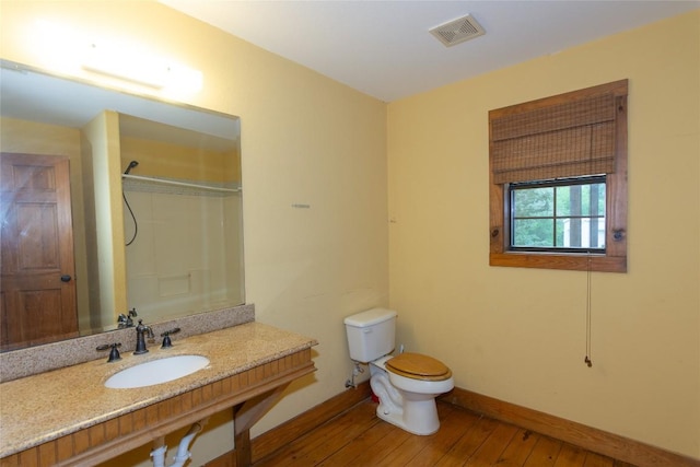2874 Fm 1704, Elgin, TX 78621 - full bathroom featuring wood-type flooring and a shower