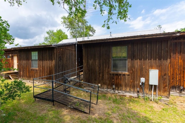 2874 Fm 1704, Elgin, TX 78621 - view of side of property with an exterior structure and board and batten siding