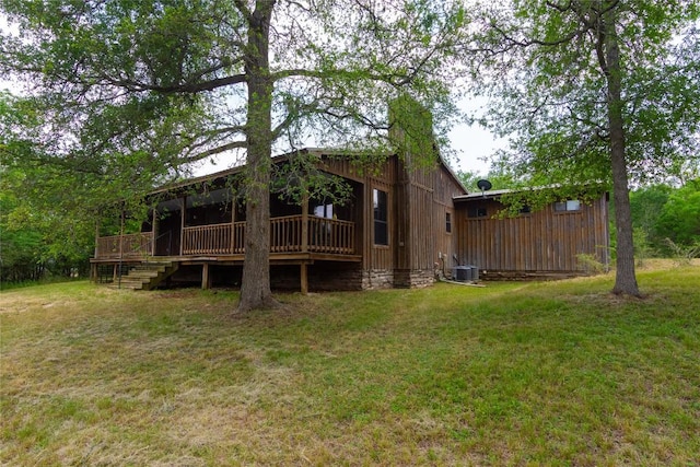 2874 Fm 1704, Elgin, TX 78621 - rear view of house with a yard, a wooden deck, and stairs