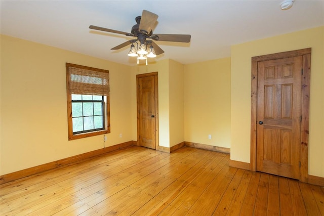 2874 Fm 1704, Elgin, TX 78621 - spare room featuring a smoke detector, light wood-style flooring, and a ceiling fan