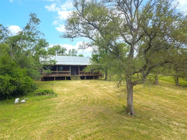 2874 Fm 1704, Elgin, TX 78621 - view of green lawn featuring a wooden deck