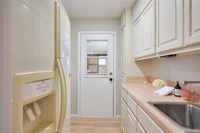 4705 Comanche, Lago Vista, TX 78645 - washroom with a sink and light wood finished floors