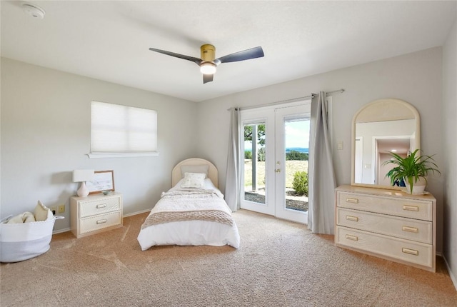 4705 Comanche, Lago Vista, TX 78645 - bedroom with access to outside, light carpet, and ceiling fan