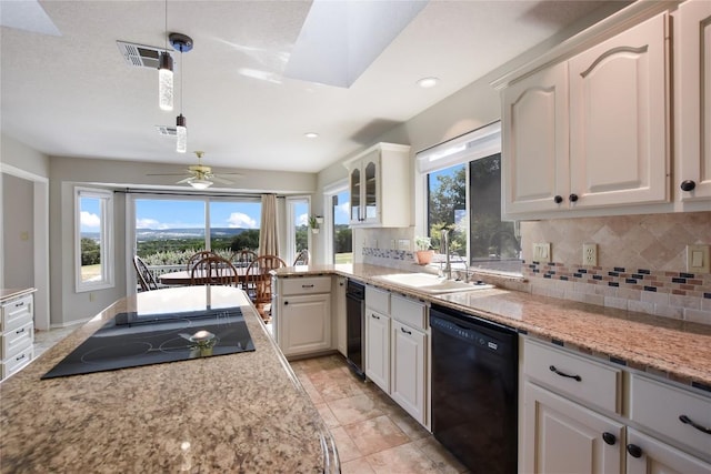 4705 Comanche, Lago Vista, TX 78645 - kitchen with black appliances, decorative backsplash, plenty of natural light, a ceiling fan, and recessed lighting