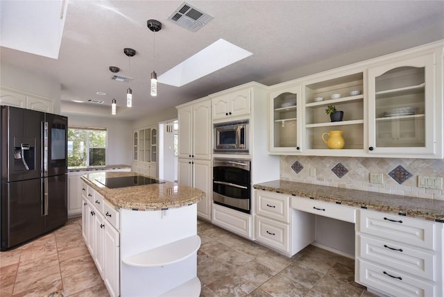 4705 Comanche, Lago Vista, TX 78645 - kitchen featuring black appliances, open shelves, a skylight, glass insert cabinets, and light stone counters