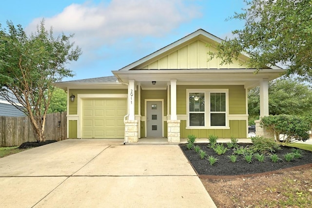 2911 Pops Way Unit 50, Austin, TX 78745 - craftsman-style home with board and batten siding, covered porch, concrete driveway, and an attached garage