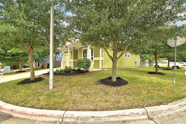 2911 Pops Way Unit 50, Austin, TX 78745 - view of property hidden behind natural elements featuring a front lawn