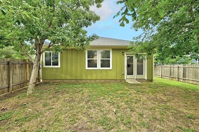 2911 Pops Way Unit 50, Austin, TX 78745 - rear view of house featuring board and batten siding and a fenced backyard
