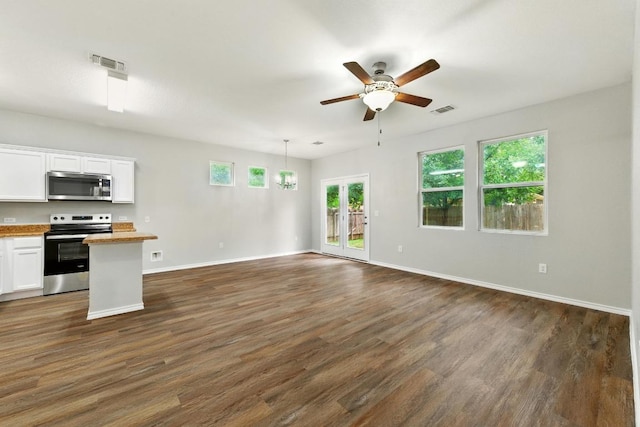 2911 Pops Way Unit 50, Austin, TX 78745 - unfurnished living room with a ceiling fan and dark wood-style flooring
