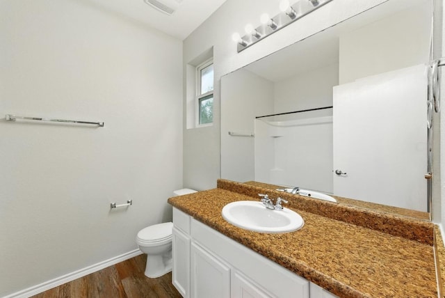 2911 Pops Way Unit 50, Austin, TX 78745 - bathroom featuring vanity, wood finished floors, and a shower