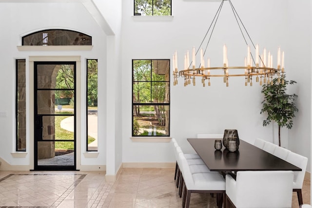 206 Lido St, Austin, TX 78734 - dining room with a chandelier, healthy amount of natural light, and a high ceiling