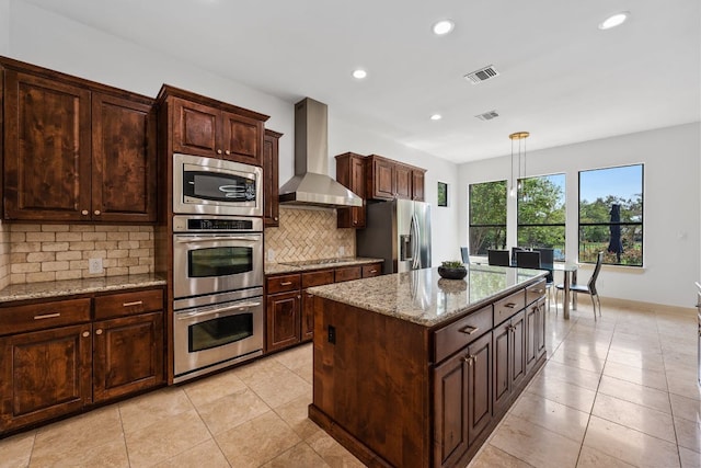 206 Lido St, Austin, TX 78734 - kitchen with wall chimney range hood, stainless steel appliances, recessed lighting, light tile patterned floors, and tasteful backsplash