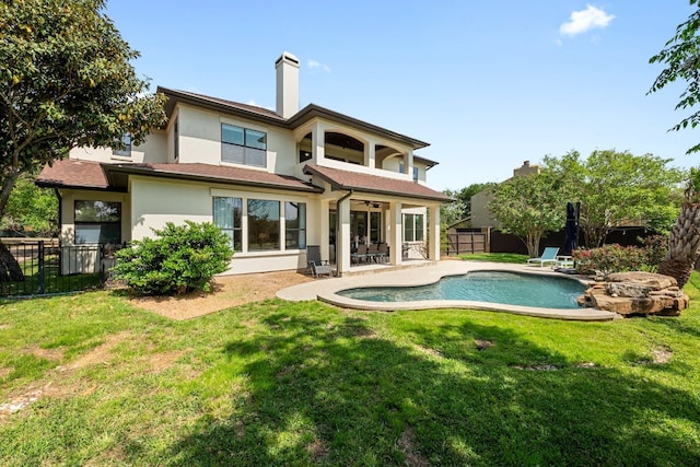 206 Lido St, Austin, TX 78734 - rear view of property with stucco siding, a fenced backyard, ceiling fan, a patio, and a chimney