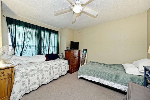 7825 Beauregard Cir Unit 25, Austin, TX 78745 - bedroom with a textured ceiling, carpet, and a ceiling fan