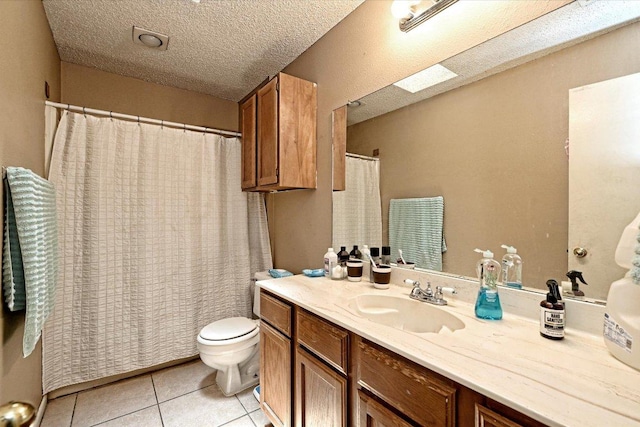 7825 Beauregard Cir Unit 25, Austin, TX 78745 - bathroom with vanity, tile patterned floors, a textured ceiling, and a shower with curtain