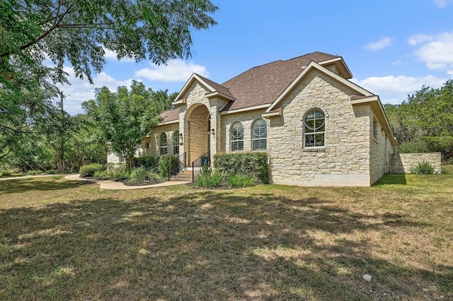 501 Flamingo Blvd, Lakeway, TX 78734 - view of front of property with stone siding and a front lawn