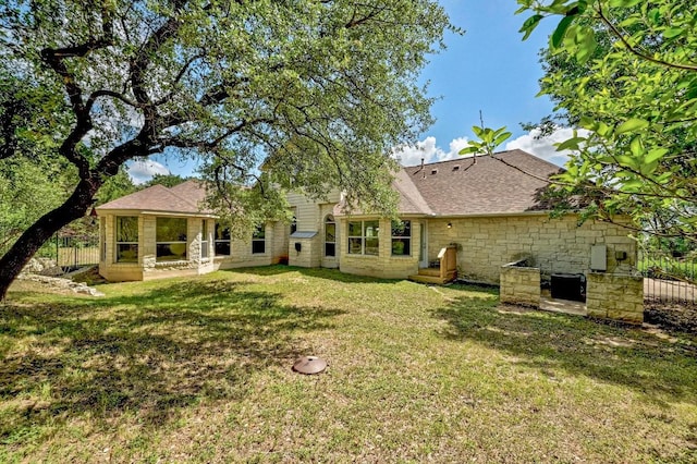 501 Flamingo Blvd, Lakeway, TX 78734 - back of property featuring stone siding and roof with shingles