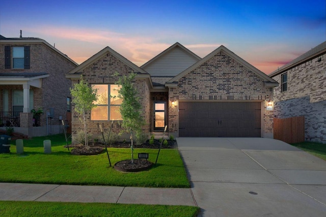 4909 Teverola Dr, Round Rock, TX 78665 - view of front of property featuring a garage, driveway, and brick siding