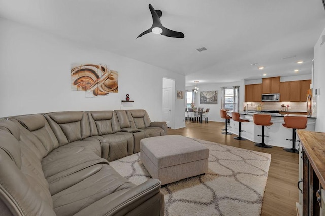 4909 Teverola Dr, Round Rock, TX 78665 - living room with recessed lighting, ceiling fan, and wood finished floors