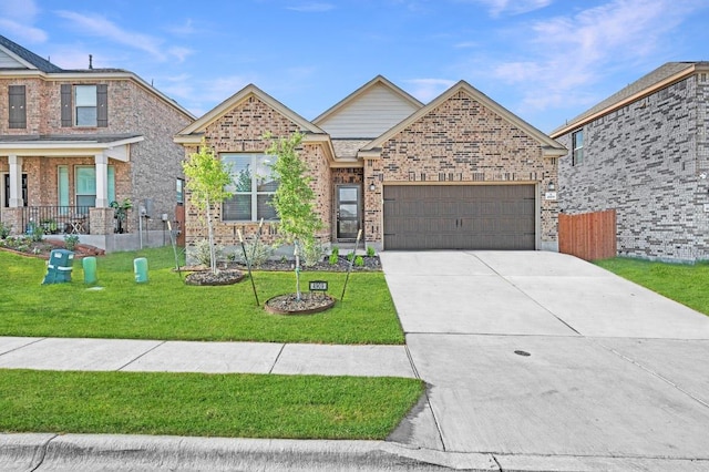 4909 Teverola Dr, Round Rock, TX 78665 - view of front facade with concrete driveway, a front yard, a garage, and brick siding