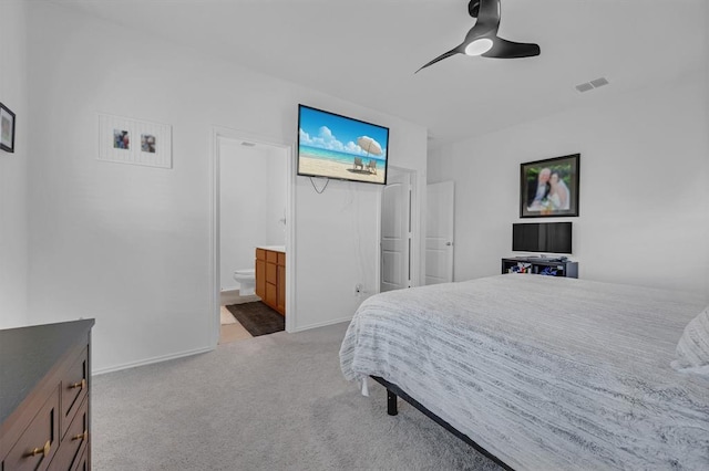 4909 Teverola Dr, Round Rock, TX 78665 - carpeted bedroom featuring ceiling fan and ensuite bath