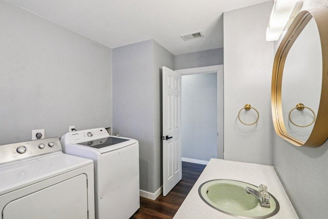 755 E Bellville St, Giddings, TX 78942 - laundry area featuring washer and clothes dryer and dark wood-type flooring