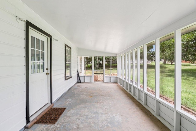 755 E Bellville St, Giddings, TX 78942 - unfurnished sunroom featuring plenty of natural light and vaulted ceiling