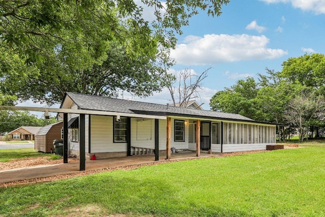 755 E Bellville St, Giddings, TX 78942 - view of front of house with a front yard and a shingled roof