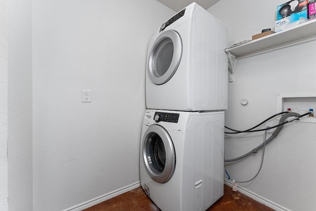 15300 Lucian St, Austin, TX 78725 - washroom featuring stacked washer and clothes dryer and baseboards