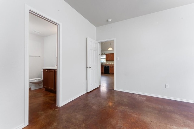15300 Lucian St, Austin, TX 78725 - unfurnished bedroom featuring concrete floors and connected bathroom
